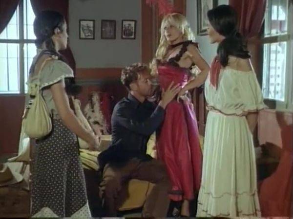 Watch uncensored clip of : Big Dick Stud The Outlaw Fucks Two Brunettes In Wild West