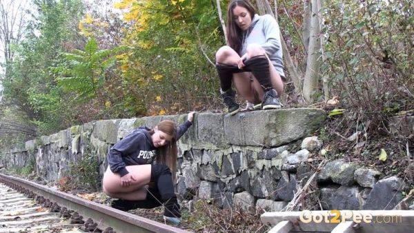 Brunette girls get desperate for a public pee session in the railway - sexu.com - Czech Republic on pornsfind.com