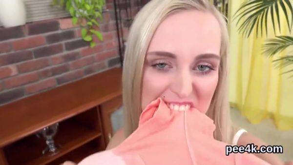 View the HD video titled : Striking Cutie Is Pissing And Masturbating Shaven Twat