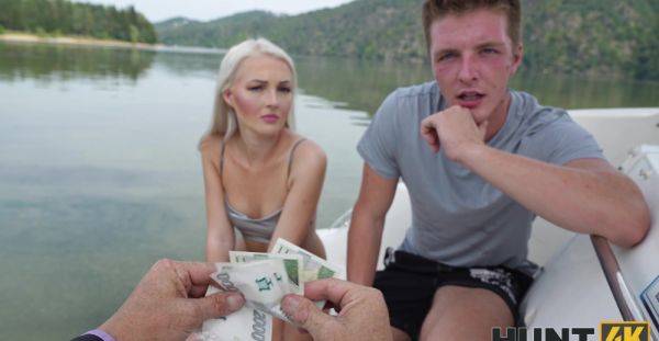 View the uncensored video of : Tanned blonde gets paid to get laid in sensual outdoor cam scenes