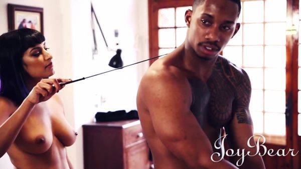 Stream the uncensored scene titled : Dominating brunette trains her black male slave