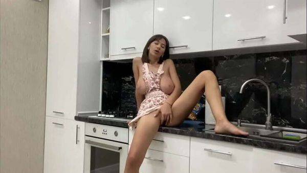 Play this uncut clip titled : Gorgeous big-titted babe Kitty Kriss pleasures herself in the kitchen, awaiting her lover