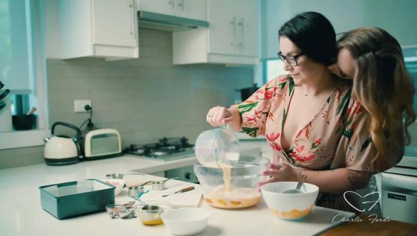 Play this uncensored clip of : Blonde Charlie Forde and Brunette Chasey Devil Lesbian Cake Baking Sex with Big Natural Tits and Glasses