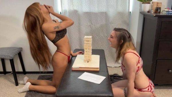 Play this uncensored scene titled : Lesbian Strip Game: Angel and Dizzy Play Tall Tumble Tower for Sex Toy Fun