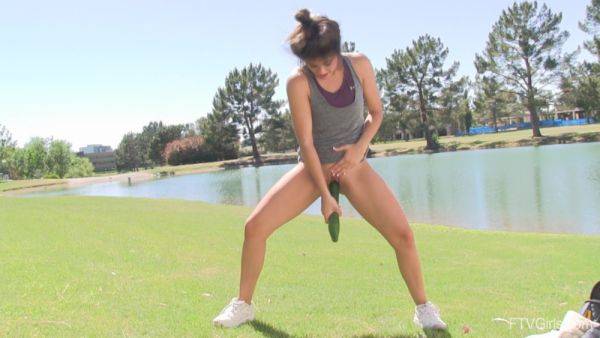 Enjoy watching this HD scene called : Slender teen shows off pushing a huge cucumber down the pussy in outdoor kinks