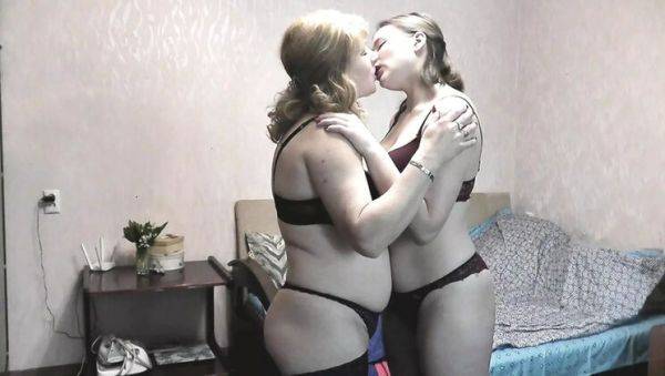 Enjoy watching this uncensored clip : Blonde MILF seduces innocent teen girl with passionate lesbian kissing