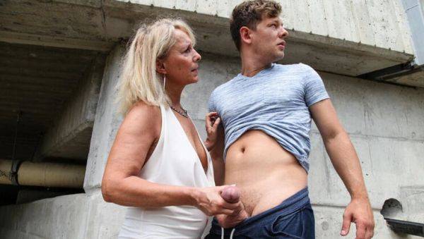 Watch this uncut scene named : Hot Granny Koko Blond Fucks Young Stud in Outdoor Public Sex