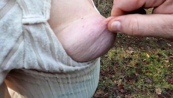 Play the full clip called : Hard Nipple Squeeze Outside