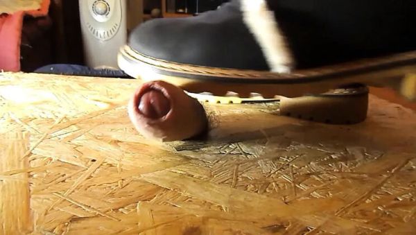 View this complete clip : Domina crushes cock with high heels